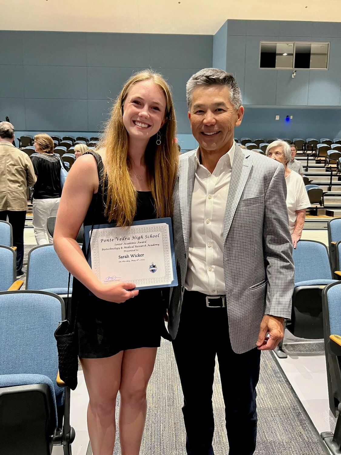 Wicker with Quang Pham, who presented the biotech scholarship she received.